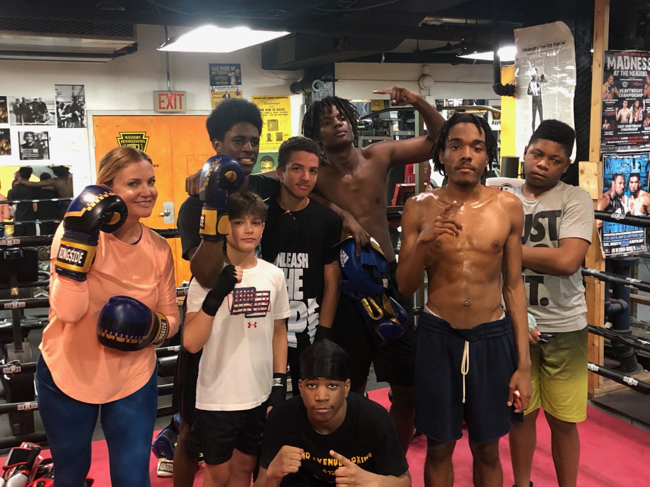 Susan with boxers at Third Avenue Gym